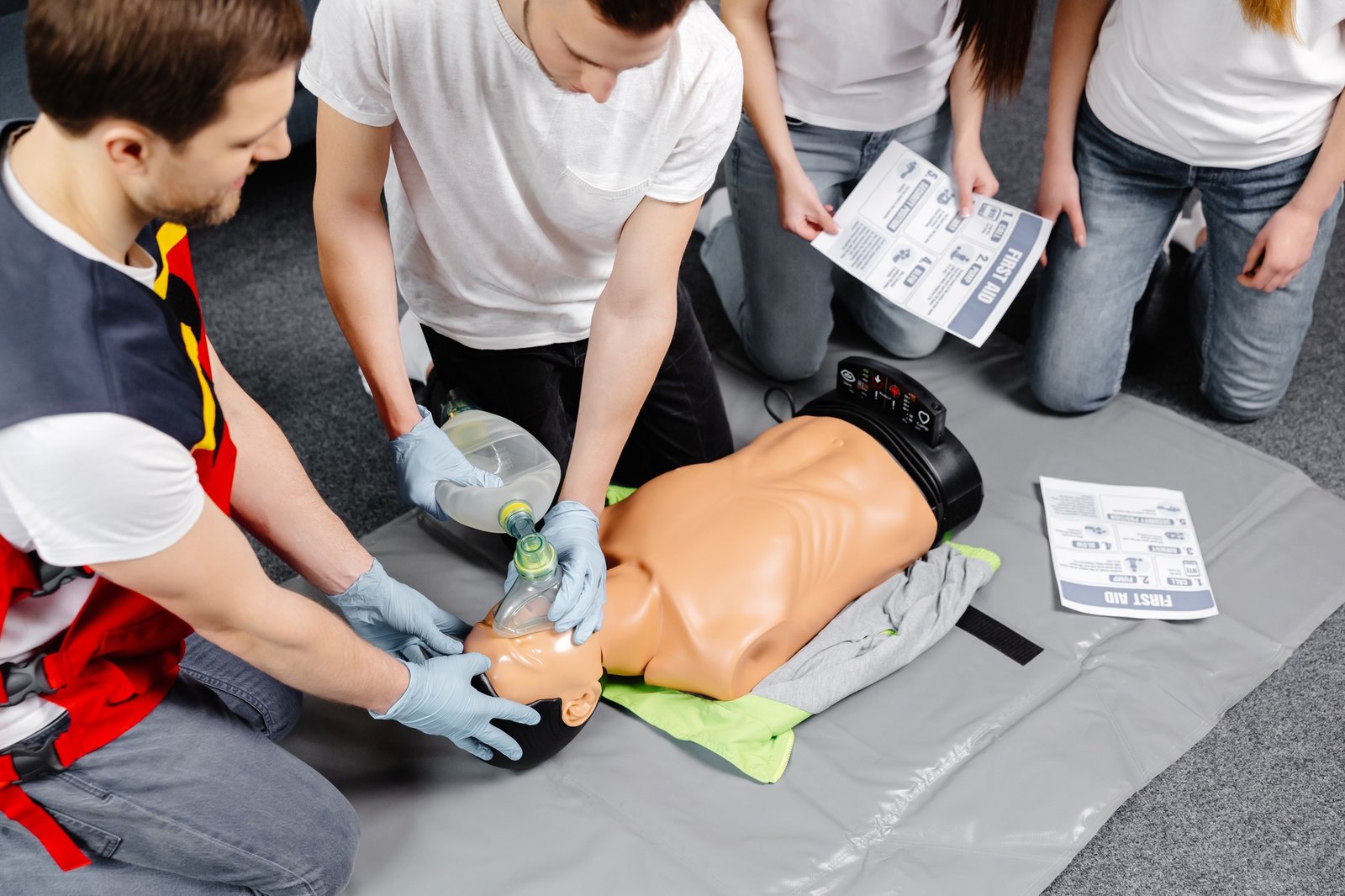 First Aid Training - Cardiopulmonary resuscitation. First aid course on cpr dummy.